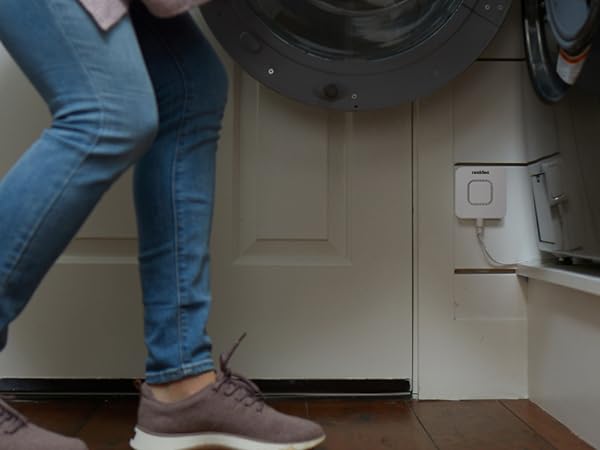 RWD42 Water Leak Detector mounted on wall next to washing machine