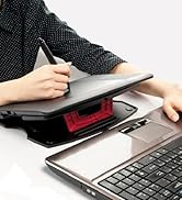 a woman is working on a laptop computer.