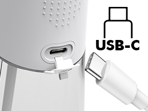 Close-up of a USB-C port on a white electronic device, with a USB-C cable partially inserted. Icon and text label visible above port.