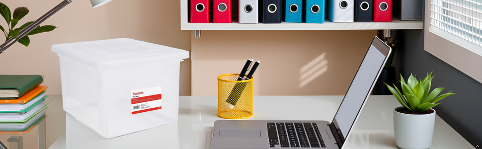A modern office desk with the product placed on it, surrounded by office supplies and a laptop.