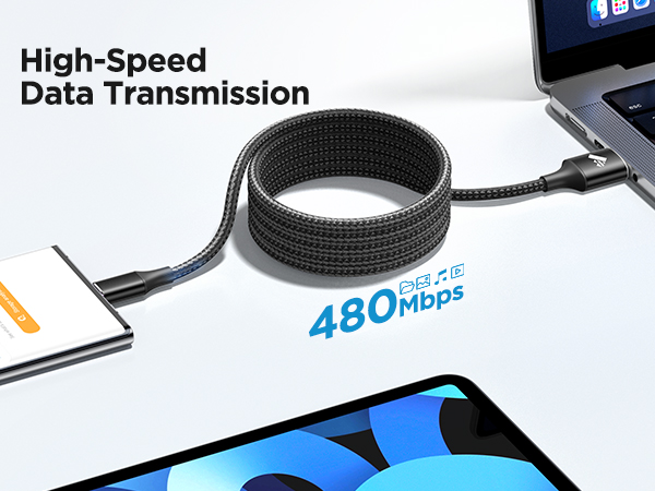Black braided USB-C cable connecting devices. Features high-speed data transmission at 480Mbps. Flexible, durable design shown coiled between laptop and tablet.