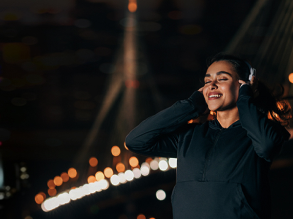 a woman wearing headphones listening to music