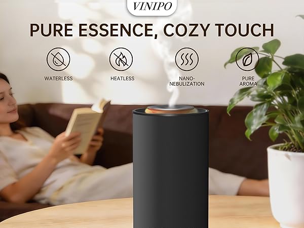 Text reads: 'PURE ESSENCE, COZY TOUCH' with four circular icons showing benefits. Black cylindrical device shown with indoor plant in background.