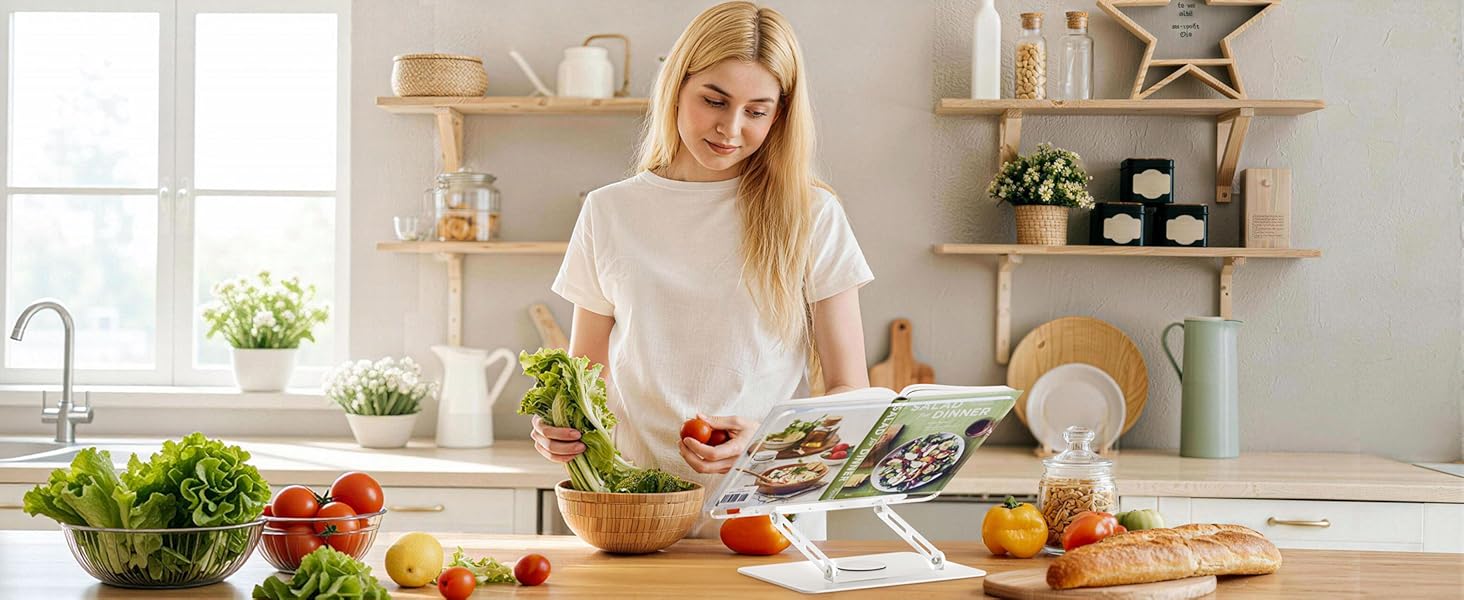 Kitchen scene showing meal preparation with fresh vegetables and ingredients on white countertop, bright natural lighting from windows.