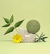Arista’s natural ingredients anti dandruff shampoo bar balanced on natural stone