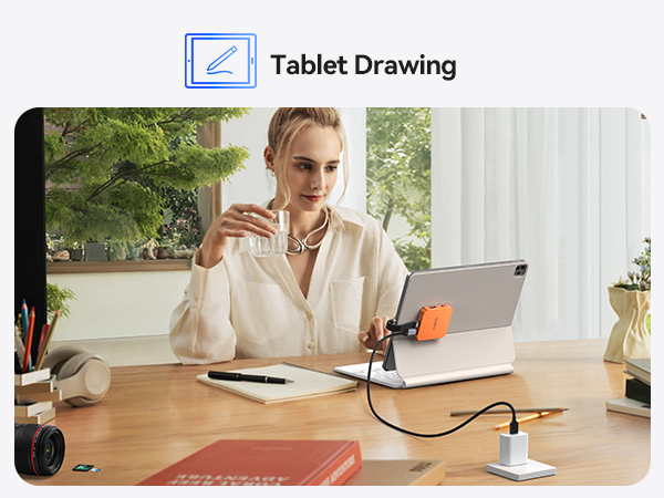 Text reads 'Tablet Drawing'. Person shown at desk using digital tablet and stylus for drawing, with laptop and desk lamp also visible.