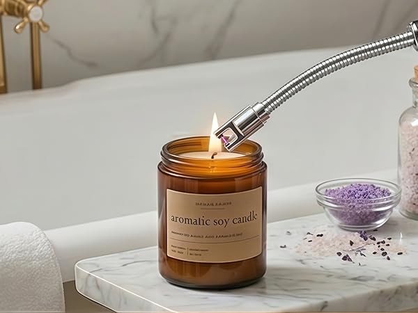 Electric candle lighter safely lighting an aromatic soy candle beside a bathtub in a warm bathroom.