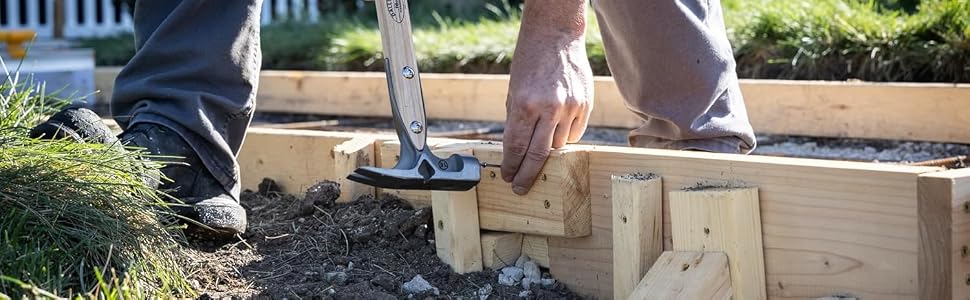 Series of photos showing hands working with wooden boards and soil in an outdoor setting, appearing to construct a raised garden bed or similar structure.