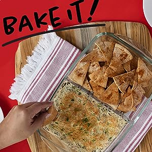 Hand over food in a glass container.