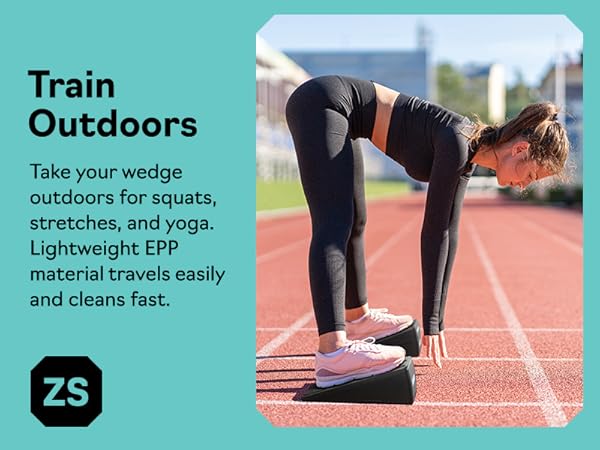 Woman stretching outdoors on slant board for calf stretching, squat wedge block and calf stretcher.