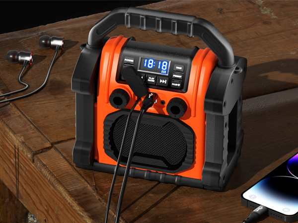 a portable radio with a microphone on a table