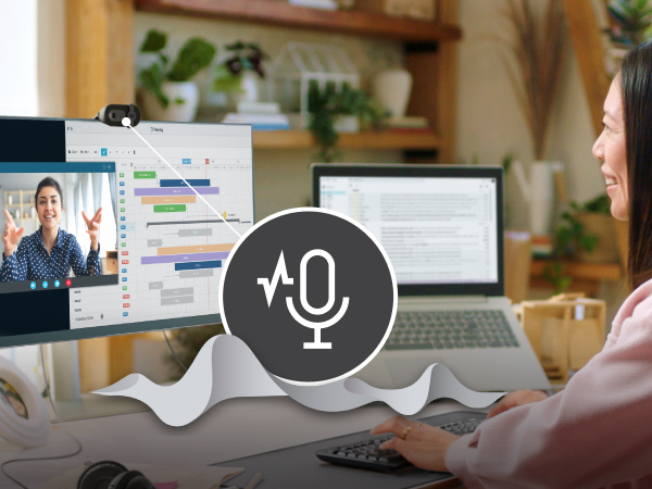 a woman having a video call using brio 101 full hd webcam for meetings and streaming