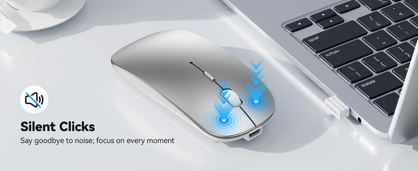 Text reads 'Silent Clicks', 'Say goodbye to noise. Focus on every moment.' Silver wireless computer mouse with blue accent details positioned next to laptop keyboard, emphasizing quiet operation feature.