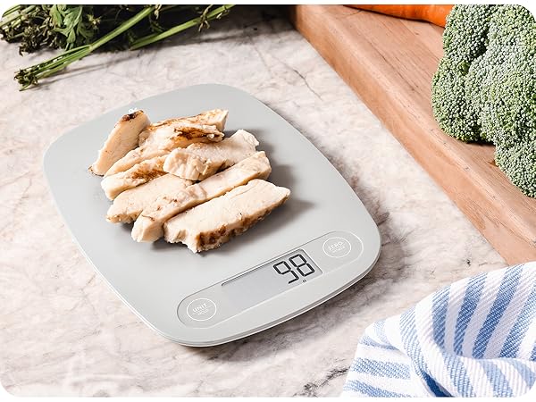 Meal prep with greater goods nutrition scale, Scale sitting on countertop with chicken on surface