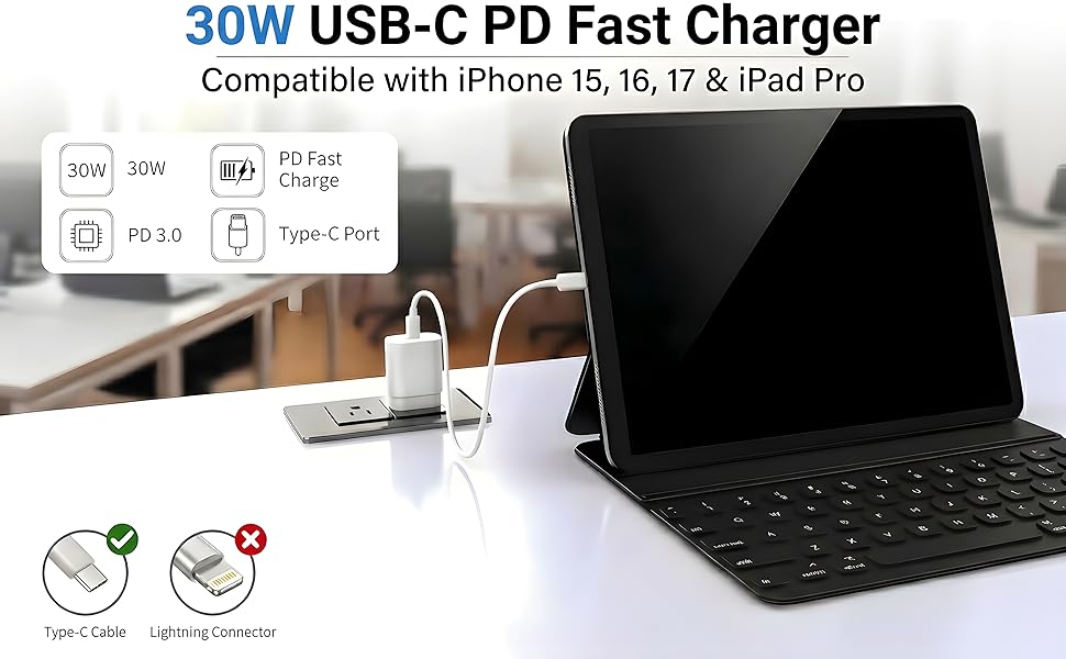 White 30W power brick plugged into desk outlet charging a tablet keyboard