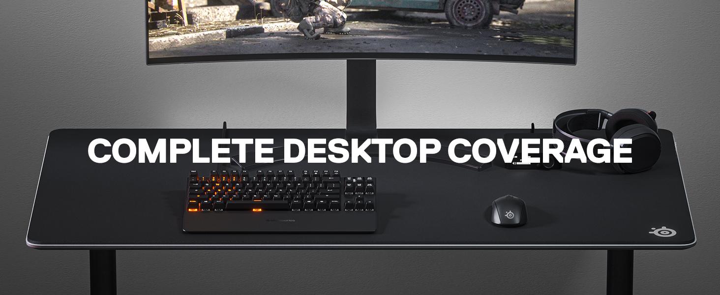 -SteelSeries desk setup with QcK 3XL mousepad, Rival mouse, wireless Arctis headset, Apex keyboard