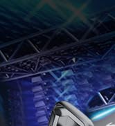 Close-up of illuminated digital instrument panel in a vehicle, showing blue-lit gauges and displays against a dark background.