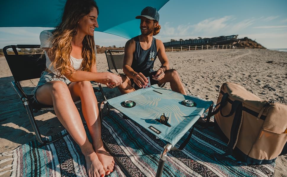 Neso Beach Table with cup holders and cell phone pockets