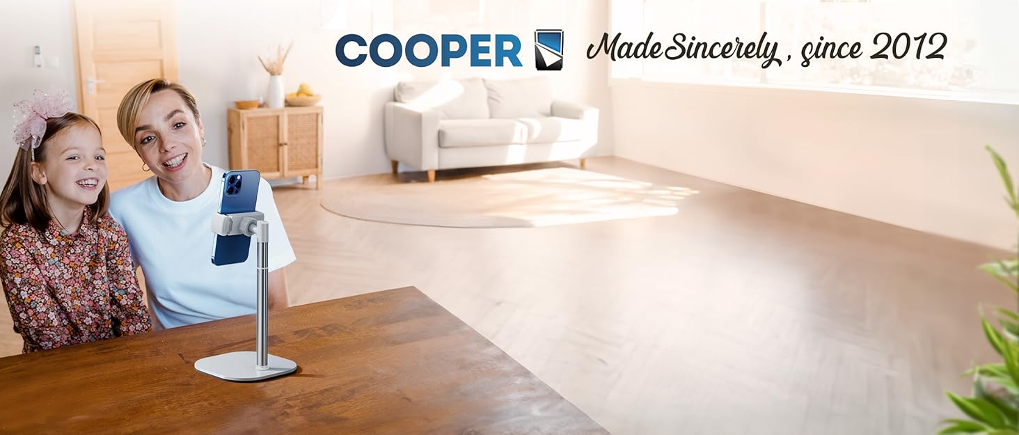 Text reads 'COOPER' and 'Made Sincerely since 2012'. Modern office setting with wooden desk and bright natural lighting through large windows.