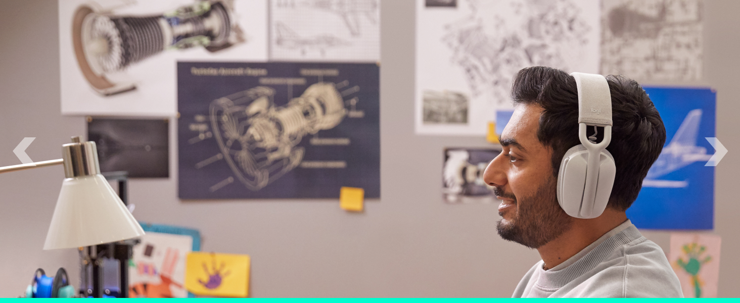 A man working on a computer and wearing Zone Vibe 100 (Off-White)