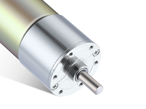 Close-up of a metallic cylindrical motor or gear mechanism with silver finish and visible shaft extension.