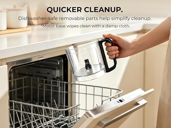 Person holding the removable processor bowl above an open dishwasher for cleanup. 
