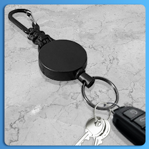 the key ring is made from a metal and has a key ring attached to it.