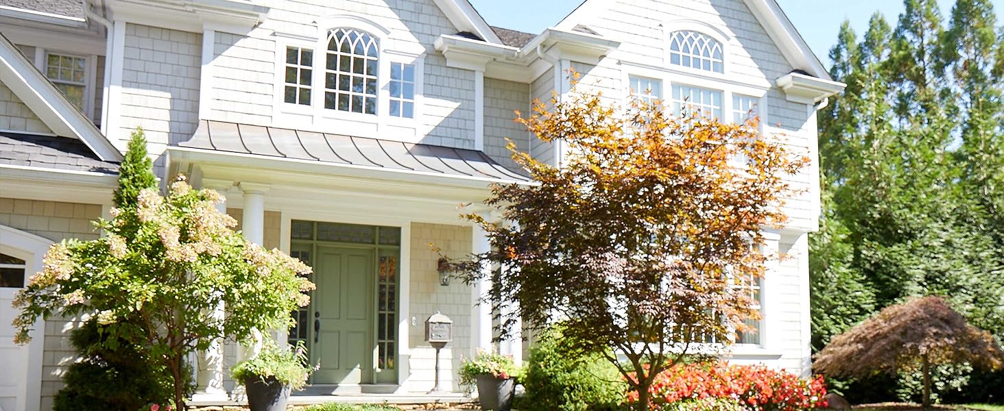 Outdoor view of home from a distance, push button doorbell installed next to door
