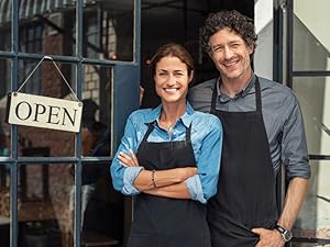 Small business owners standing proudly outside shop. leadership, productivity, &amp;amp;amp; success.