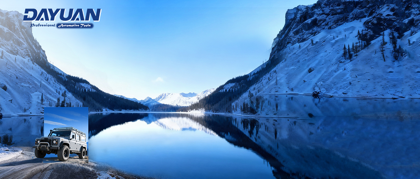 Text reads 'DAYUAN'. Panoramic winter landscape showing snow-covered mountains and frozen lake under blue sky.