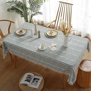 Grey tablecloth, rectangular linen, tassel detail, dining elegance, modern textile