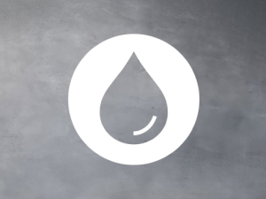 Liquid drop in white circle on dark grey background. 