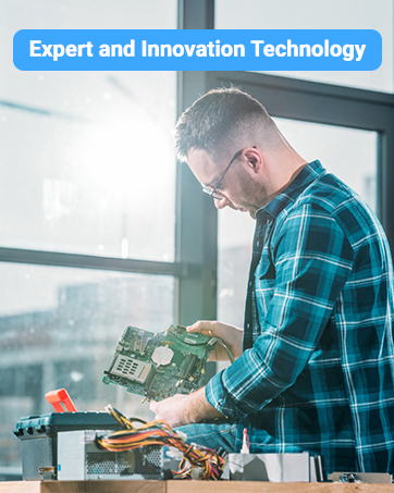 Circuit board or electronic component being worked on with tools, shown on a workspace in indoor lighting conditions.