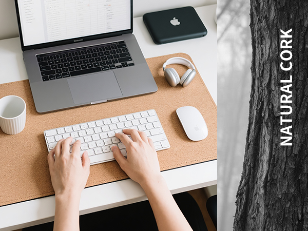 Hands work on the key board ,Cork mouse pad for laptop on the desk