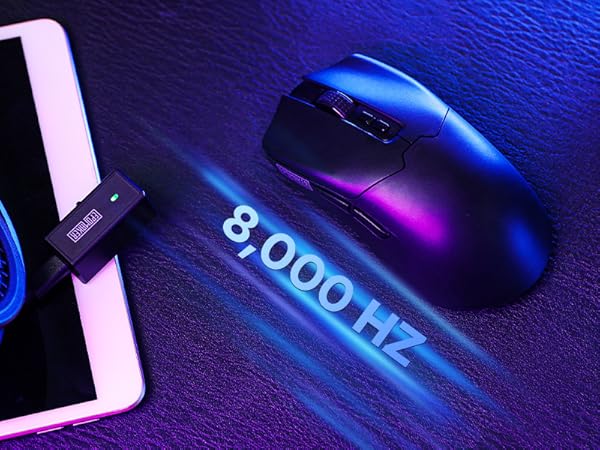 a mouse and a smartphone on a table.