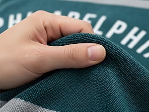 person showing the fabric of the towel