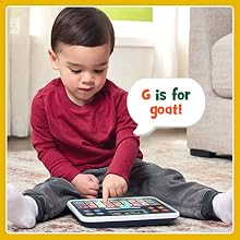 Kid presses light up G button on the LeapFrog My First ABC Tablet. Tablet says: G is for goat!