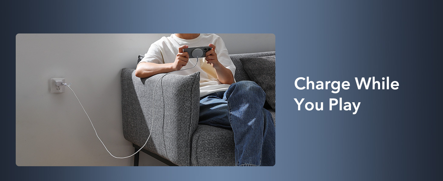 a man sitting on a couch holding a video game controller.