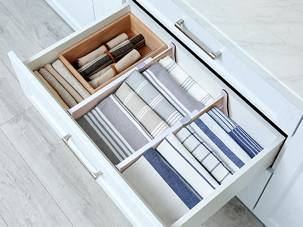 Drawer dividers used inside a kitchen drawer for napkins