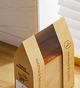 Partially visible cardboard box with flaps open, likely for packaging or shipping purposes.