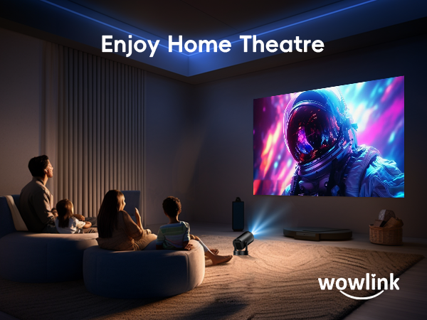 Home theater setup with large projector screen displaying vibrant space-themed image. People seated on couch, text 'Enjoy Home Theatre' above screen, 'wowlink' logo in corner.