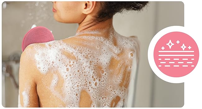 exfoliating in shower using pink silicone exfoliator for smooth soft skin