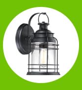 The Kellen is a textured black finish outdoor wall lantern with clear seeded glass.