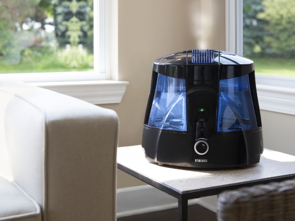 black humidifier in living room next to sofa