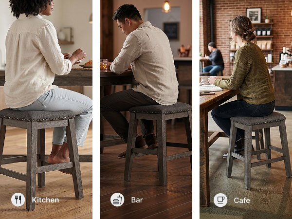 Kitchen island setting with backless counter height bar stools featuring a gray wood finish