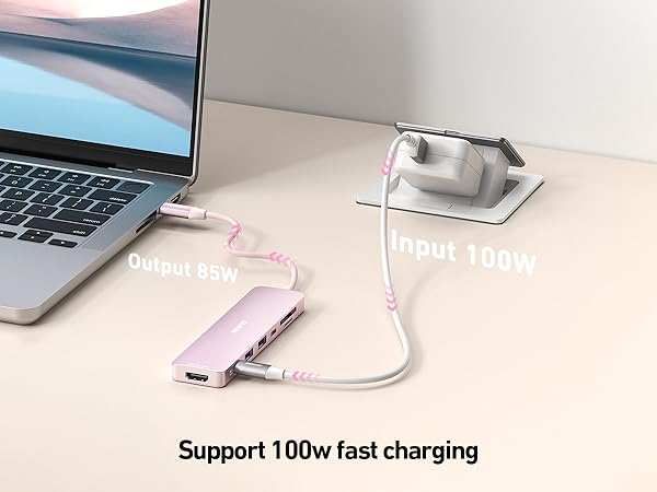 Fast charging adapter setup with laptop connection, showing 100w charging support capability and input/output power indicators.