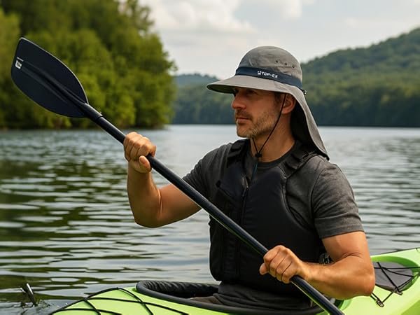 Man kayaking on lake wearing TOP-EX cooling sun hat with neck flap and wide brim for sun protection