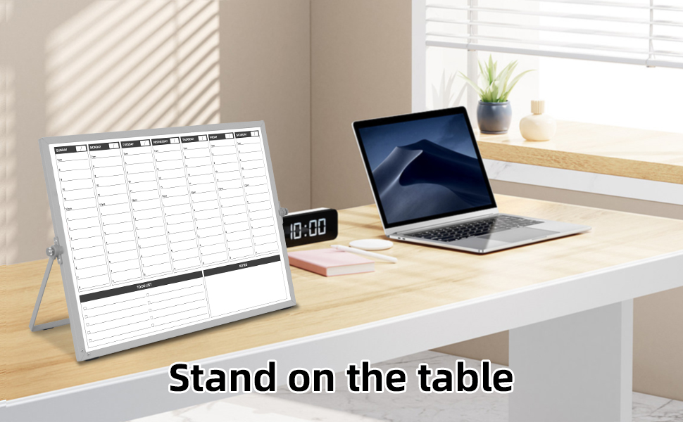 whiteboard calendar stand neben by the laptop