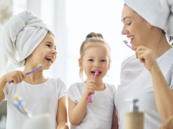 family brushing teeth