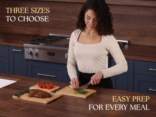 Three cutting board sizes with juice grooves and easy-grip side handles.